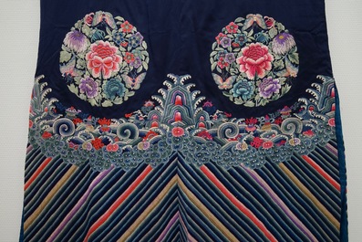 A Chinese blue ground silk informal woman's robe, 19th C.