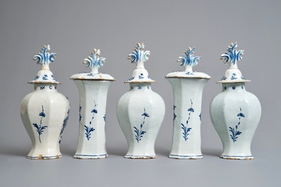 A Dutch Delft blue and white five-piece garniture with birds of paradise, 18th C.