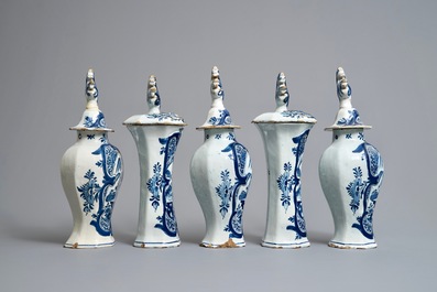 A Dutch Delft blue and white five-piece garniture with birds of paradise, 18th C.