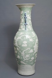A massive Chinese relief-decorated celadon 'dragon' vase, 19th C.
