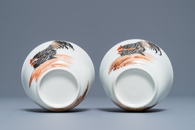 A pair of fine Chinese cups and saucers with roosters and chickens, Qianlong