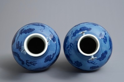 A pair of Chinese lavender blue vases with underglaze dragons, 18/19th C.