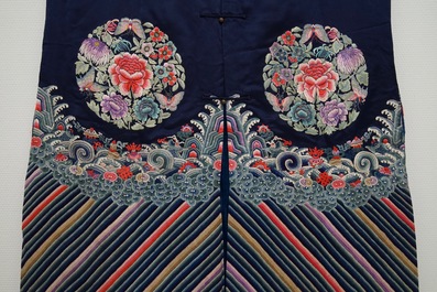 A Chinese blue ground silk informal woman's robe, 19th C.