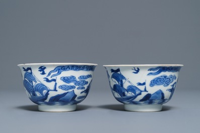 A pair of Chinese blue and white French market cups and saucers with texts, Kangxi