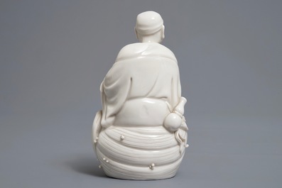 Two Chinese Dehua blanc de Chine models of a Luohan and Guanyin with servant, 19th C.