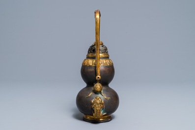 A Chinese parcel-gilt bronze double gourd hanging censer and cover, Kangxi mark, Qing