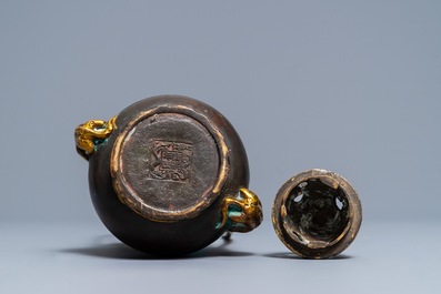 A Chinese parcel-gilt bronze double gourd hanging censer and cover, Kangxi mark, Qing