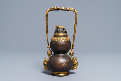 A Chinese parcel-gilt bronze double gourd hanging censer and cover, Kangxi mark, Qing