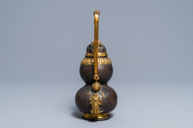 A Chinese parcel-gilt bronze double gourd hanging censer and cover, Kangxi mark, Qing