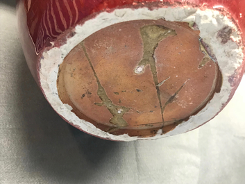 A pair of Chinese monochrome oxblood-glazed jars and covers, 19th C.