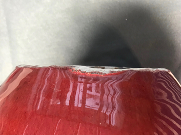 A pair of Chinese monochrome oxblood-glazed jars and covers, 19th C.