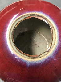 A pair of Chinese monochrome oxblood-glazed jars and covers, 19th C.