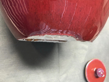 A pair of Chinese monochrome oxblood-glazed jars and covers, 19th C.
