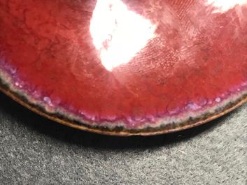A pair of Chinese monochrome oxblood-glazed jars and covers, 19th C.