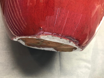 A pair of Chinese monochrome oxblood-glazed jars and covers, 19th C.
