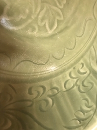 A Chinese Longquan celadon dish with underglaze floral design, Ming