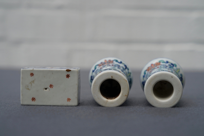 A pair of Chinese doucai scroll ends and a famille rose paper weight, 19/20th C.