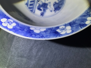 A Chinese blue and white bowl with figures in a garden, Kangxi mark and of the period