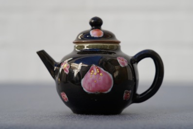 A small Chinese famille rose black ground teapot and cover, Yongzheng/Qianlong