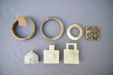 A collection of 23 Chinese jade, soapstone and hardstone seals, carvings, hooks and bangles, 19/20th C.