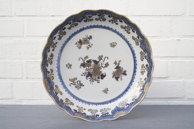 A Chinese blue, white and gilt part service, Qianlong