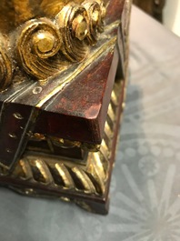 A pair of Chinese gilt-laquered wood Buddhist lions, 19th C.