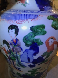 A Chinese wucai baluster vase and cover with playing boys, Transitional period