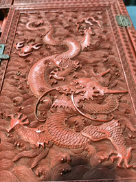 A Chinese cinnabar 'dragons and phoenixes' lacquer cabinet, 19th C.