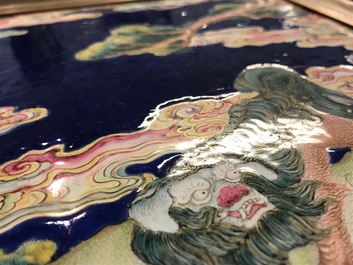 A Chinese Canton enamel plaque with a Buddhist lion in a landscape, Qianlong