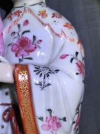 A pair of Chinese famille rose candle holders shaped as court ladies, Qianlong