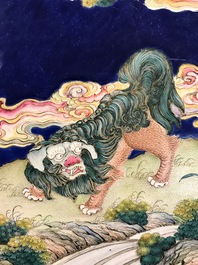 A Chinese Canton enamel plaque with a Buddhist lion in a landscape, Qianlong