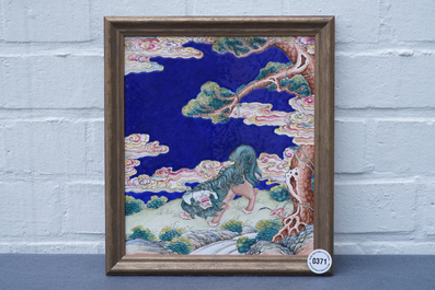 A Chinese Canton enamel plaque with a Buddhist lion in a landscape, Qianlong