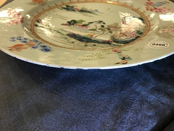 A Chinese famille rose &quot;Eight Immortals&quot; charger with a central landscape, Qianlong