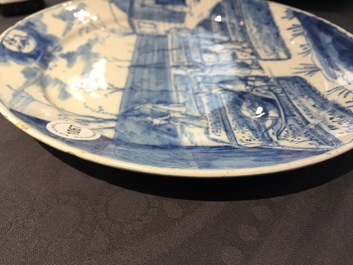 A Dutch Delft blue and white plate with peasants from the 'Zodiac' series, first quarter 18th C.