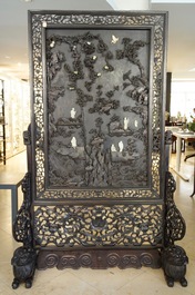 A large Chinese carved zitan wood panel with jade and turquoise, set in a hongmu wood frame and stand, Qianlong