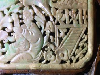 A small Chinese jade plaque mounted in a carved wood table screen, 19/20th C.