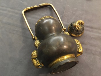 A Chinese parcel-gilt bronze double gourd hanging censer and cover, Kangxi mark, Qing