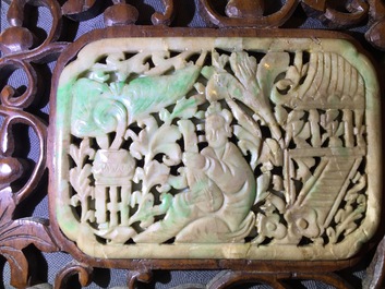 A small Chinese jade plaque mounted in a carved wood table screen, 19/20th C.