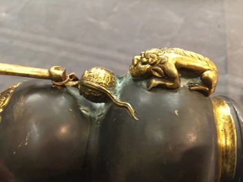 A Chinese parcel-gilt bronze double gourd hanging censer and cover, Kangxi mark, Qing