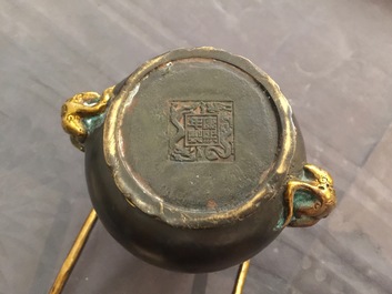 A Chinese parcel-gilt bronze double gourd hanging censer and cover, Kangxi mark, Qing