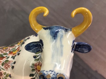 A pair of polychrome Dutch Delft models of cows on bases with frogs, 18th C.