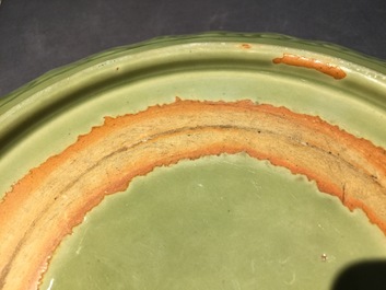 Een Chinese Longquan celadon schotel met onderglazuur floraal decor, Ming