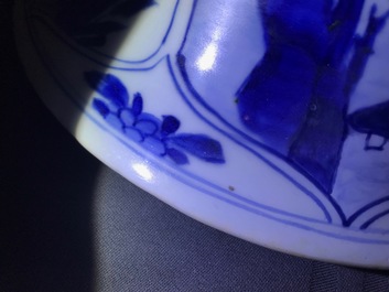 Een groot driedelig Chinees blauwwit kaststel met landschappen en bloemen in vakverdeling, Kangxi