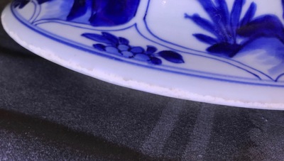 Een groot driedelig Chinees blauwwit kaststel met landschappen en bloemen in vakverdeling, Kangxi