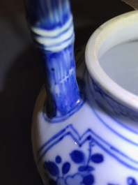 A Chinese blue and white gate-handled teapot and cover, Kangxi