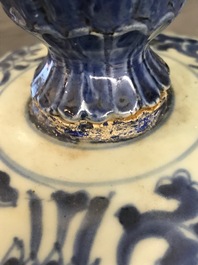 A tall Chinese blue and white 'lotus scroll' vase and cover, Kangxi