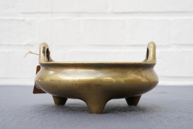 A Chinese bronze tripod censer, Xuande mark, 18th C.