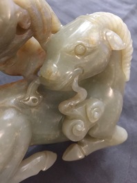 A Chinese celadon and russet jade 'rams' group, 18/19th C.