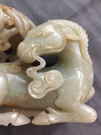 A Chinese celadon and russet jade 'rams' group, 18/19th C.