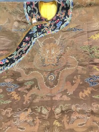A Chinese brown ground eight-dragon embroidered silk robe, Qianlong